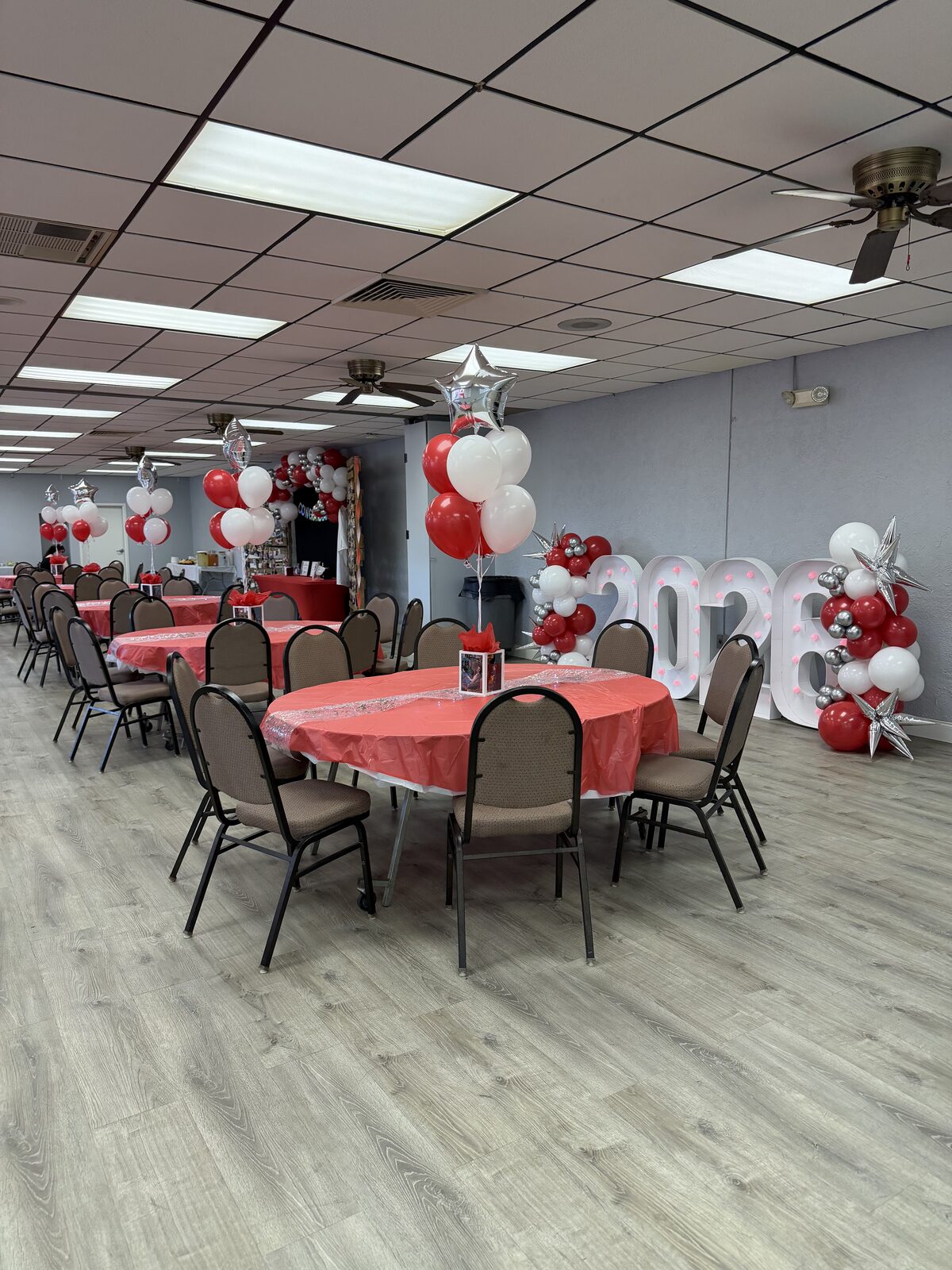 Graduation party with marquee letters and balloon garland