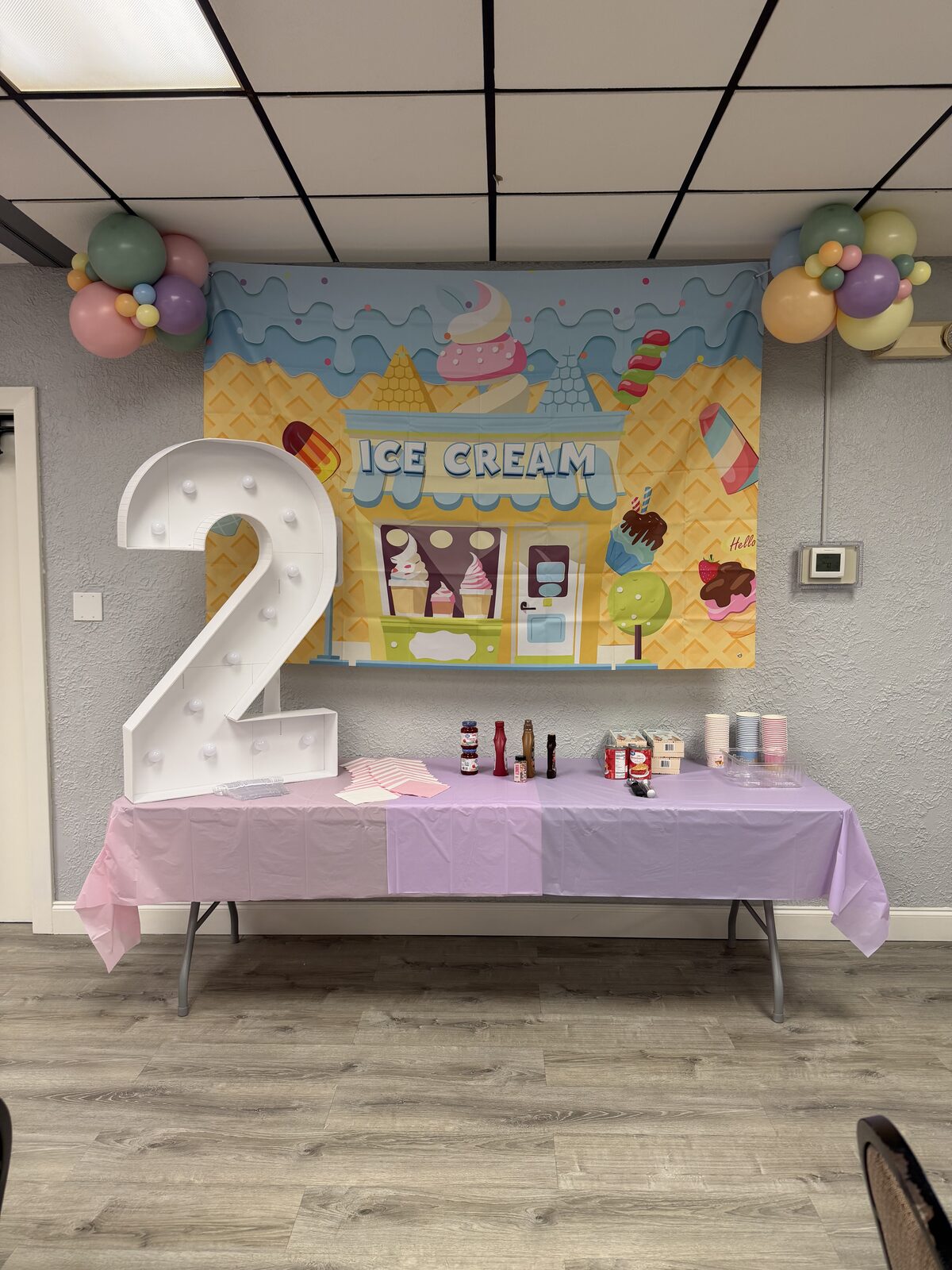 Two Sweet second birthday backdrop with an ice cream theme